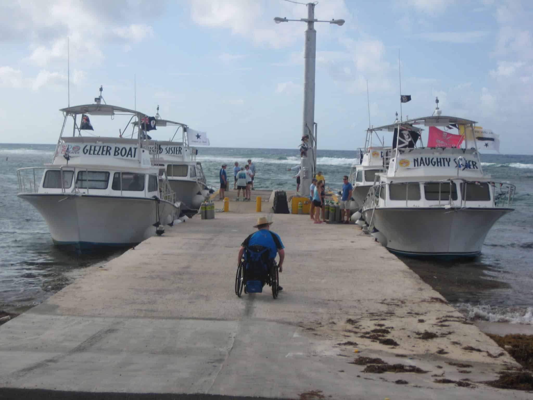 Man in wheelchair at port