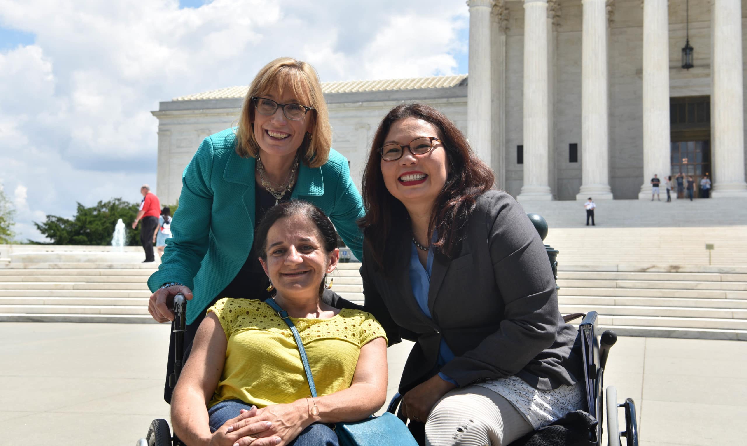 Senator Duckworth with two women