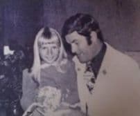 Gianna Rojas as a little blonde girl on lap of Arnold Palmer