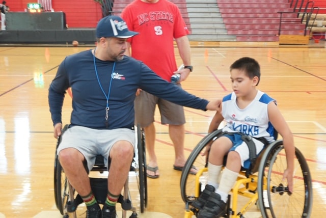 Coach Luis and young player, Ben.