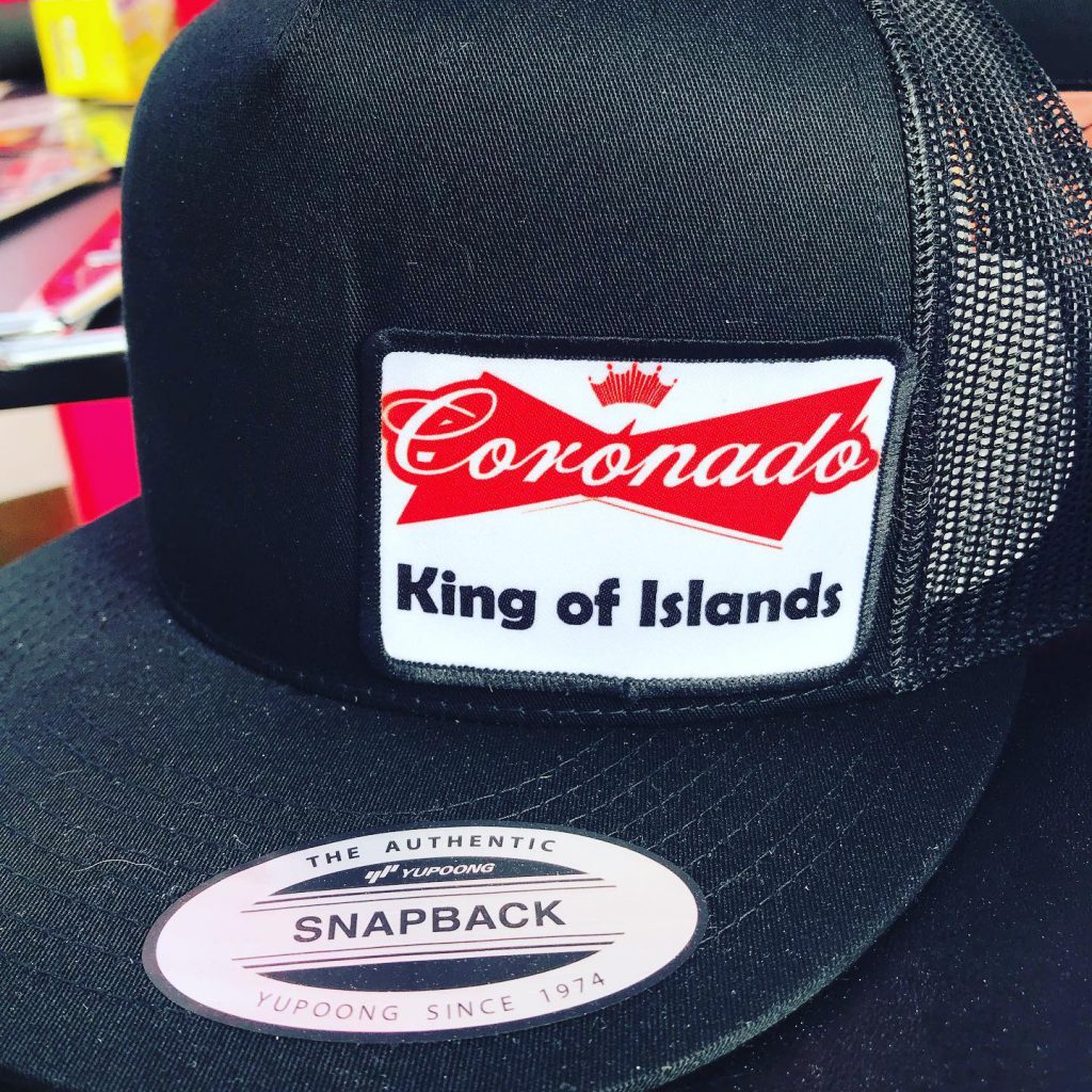 A hate with a patch that reads, "Coronado, King of Islands."